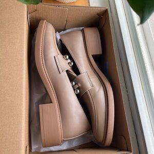 Tan loafers. Less than 2 in heel. Veryy comfortable and flexible. Never worn.